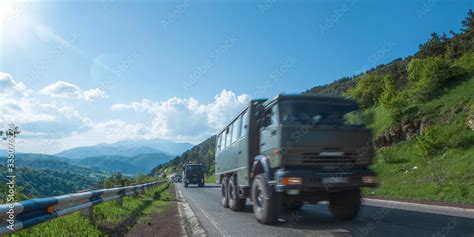 convoy of military trucks rides on the highway Stock Photo | Adobe Stock