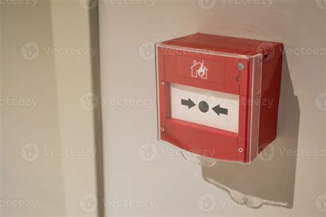 Red fire alarm button on wall , 24200134 Stock Photo at Vecteezy