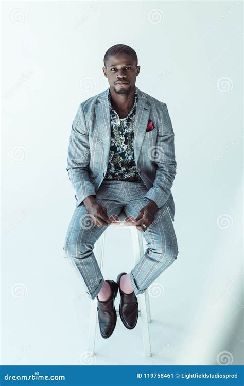 Handsome African American Man in Suit, Sitting on a Bar Stool and Looking at Camera, Stock Image ...