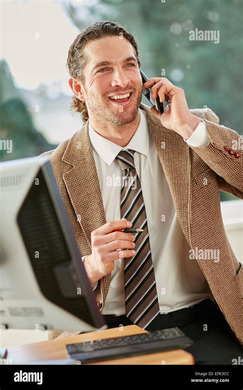 Man working in office Stock Photo - Alamy