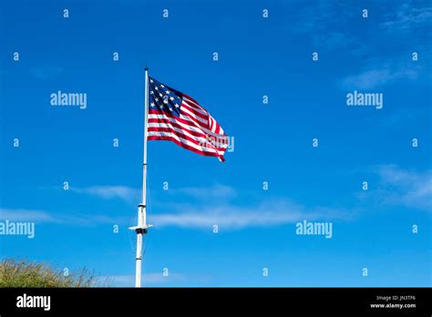 The great garrison flag, a replica of the 1812 flag, flies at Fort ...