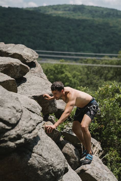 Photo of a Man Climbing Rocks · Free Stock Photo