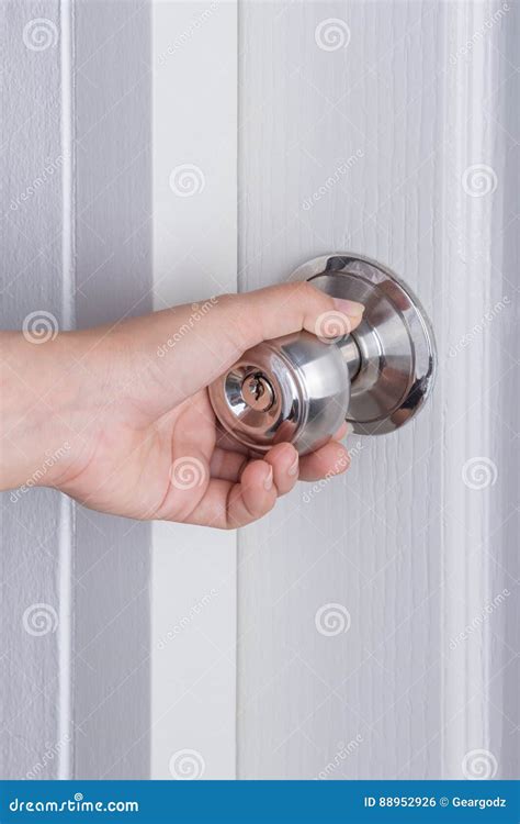 Hand Opening Door Knob on White Door Stock Photo - Image of security ...