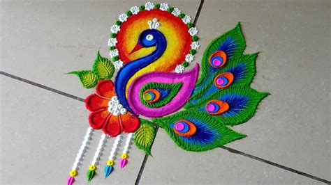 Bright and stunning peacock rangoli | Unique free hand peacock kolam ...