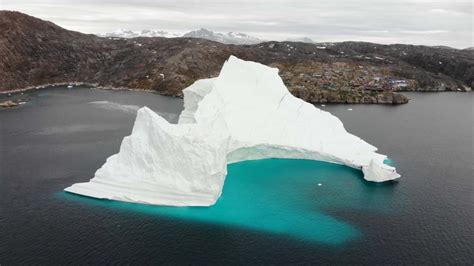 A huge iceberg is threatening a tiny village in Greenland - CNN