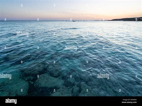 Sunset time in Santo Tomas bay on the island of Menorca Stock Photo - Alamy