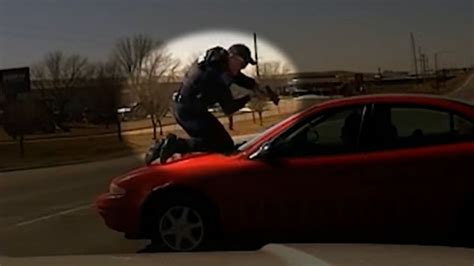 Traffic stop turns into terrifying chase with cop on top of speeding ...