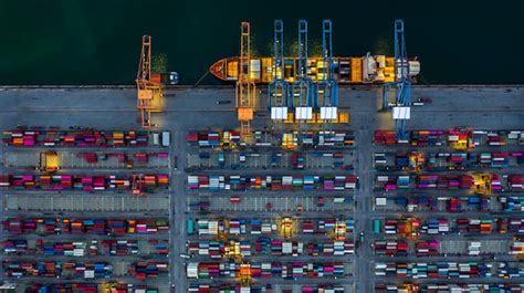 Premium Photo | Industrial sea port working at night with container ...