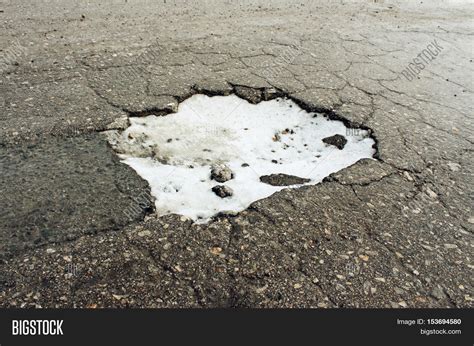 Large pit on the old road in the winter Stock Photo & Stock Images ...