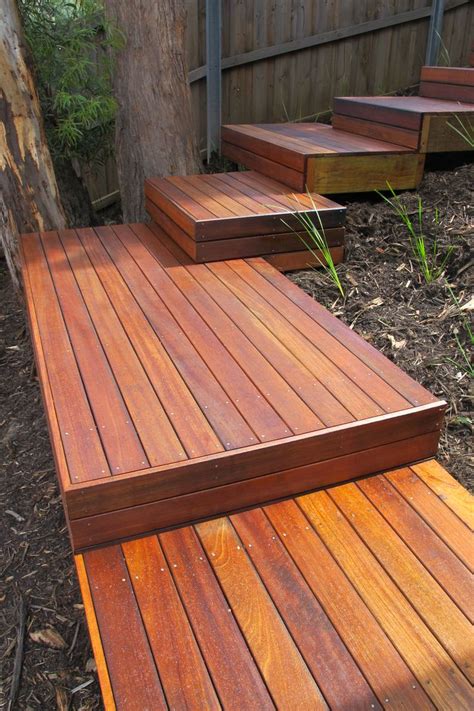 a wooden deck with steps leading up to it