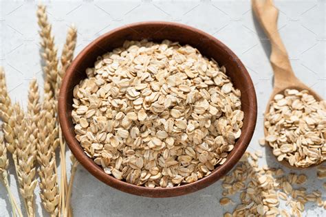 Rolled oats or oat flakes in bowl | High-Quality Food Images ~ Creative ...