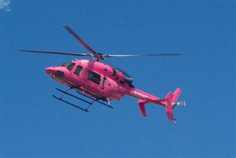 Pink Helicopter in Blue Sky