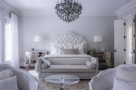 Luxury bedroom with a gray color scheme features a white velvet tufted ...