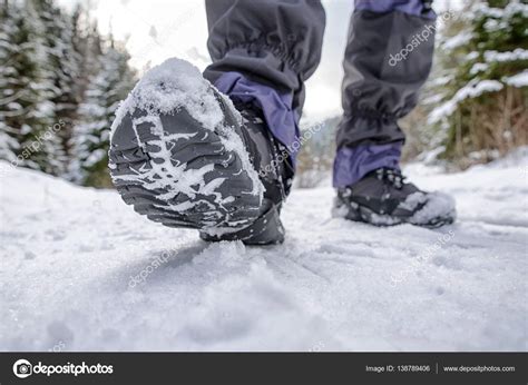 Hiking boots in snowy forest Stock Photo by ©jarino 138789406