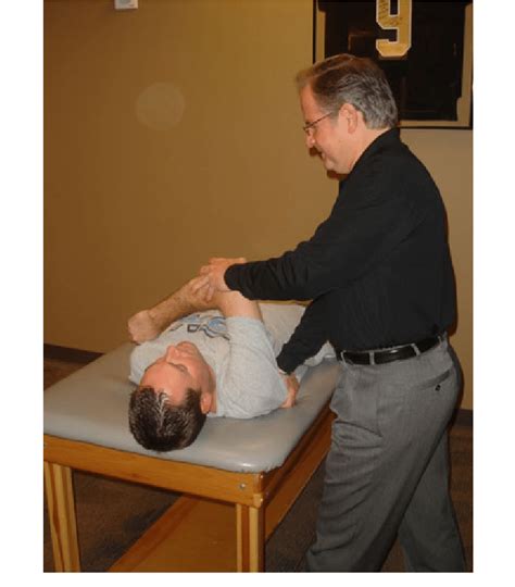 Horizontal adduction stretch performed by the rehabilitation specialist ...