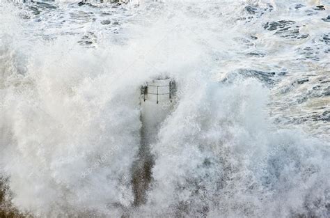 Lighthouse during a sea storm — Stock Photo © luisapuccini #19943945