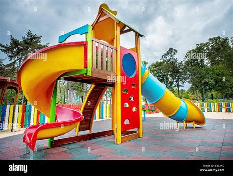 Colorful children playground in the park Stock Photo - Alamy