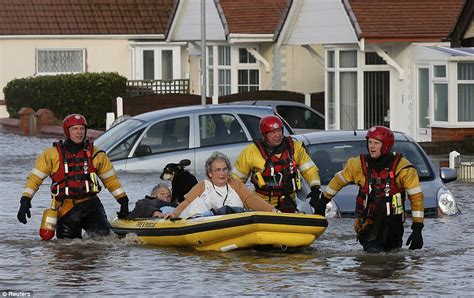 Britain battered by worst tidal surge in 60 years: Sea walls breached ...