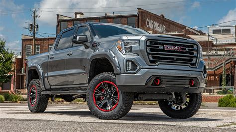 GMC BLACK WIDOW LIFTED TRUCKS — SCA Performance | Black Widow Lifted Trucks