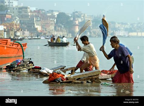 India, Uttar Pradesh, Varanasi, Ganga river, People washing clothes ...