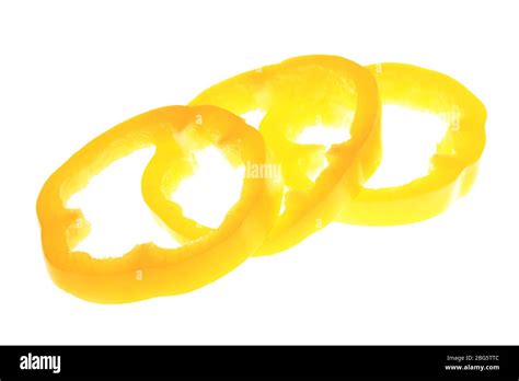 Fresh yellow pepper slices isolated on white Stock Photo - Alamy