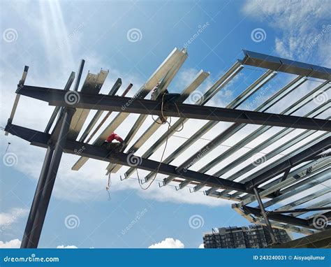 Construction Workers Installing Metal Roof Trusses at the Construction ...