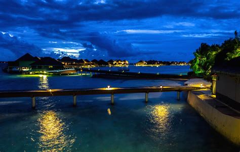 Panoramic view of the water bungalows at night, Vadoo Resort, Maldives ...