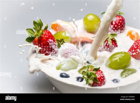 Fresh fruits and milk splash Stock Photo - Alamy