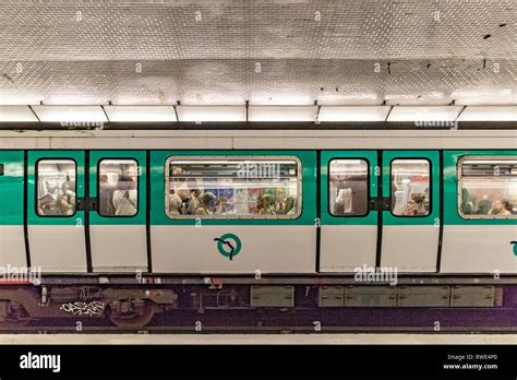 People on a Paris Metro train at St Georges Metro station in the 9th ...