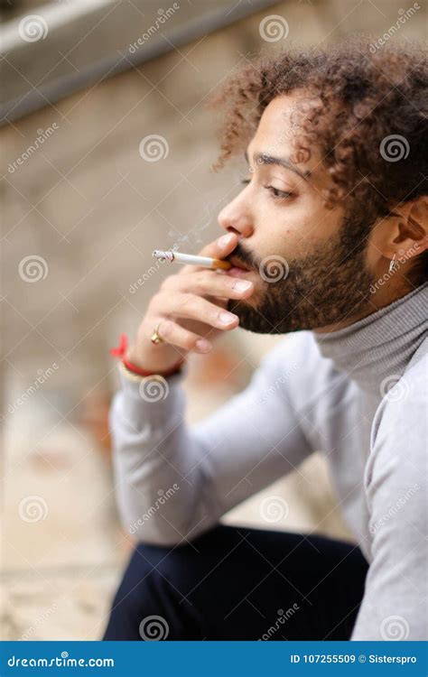 Sad Mix Blood Man Smoking on Steps. Stock Image - Image of handsome ...