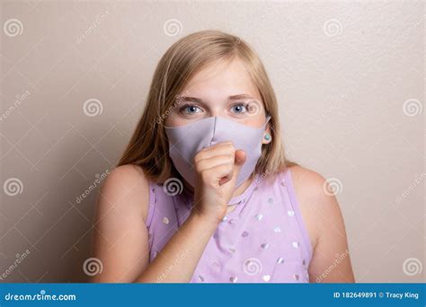 Head on Image of Girl Coughing into Her Mask Stock Image - Image of ...