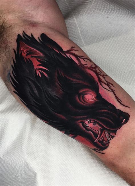 Wolfs Upper Arm Tattoo | Wolf tattoos, Hand tattoos for guys, Body art ...