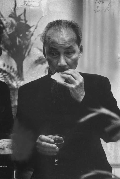 Vietnamese Communist leader Ho Chi Minh eating at a reception during ...