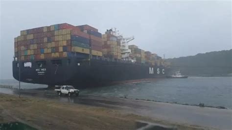 Violent storm blows massive container ship into harbour blocking port ...