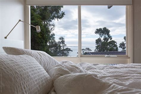 "An Unmade Bed With A View Of The Ocean" by Stocksy Contributor "Jodie ...