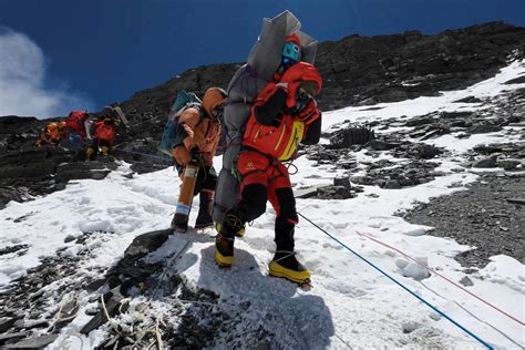 Sherpa carries struggling climber thousands of feet down Mount Everest ...