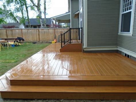 Composite deck with wrap around step | Deck Masters, LLC