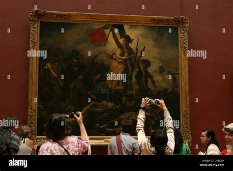 Visitors at the painting liberty leading the people by delacroix hi-res ...