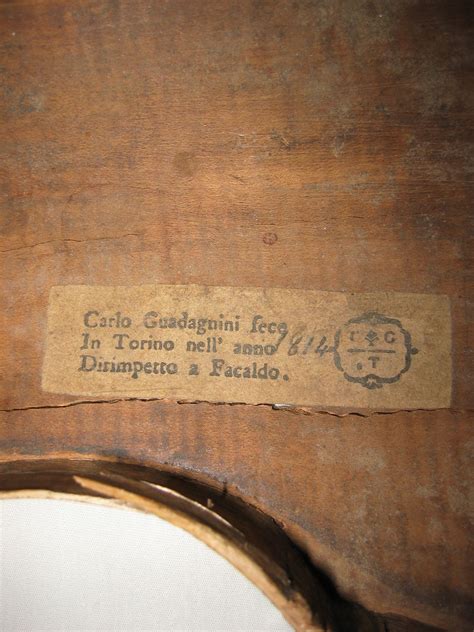 an old wooden chair with a label on it that says, carlo gaddagnii