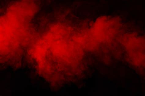 Premium Photo | Red smoke on black background