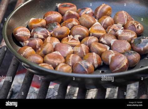 chestnuts roasting on an open fire Stock Photo - Alamy