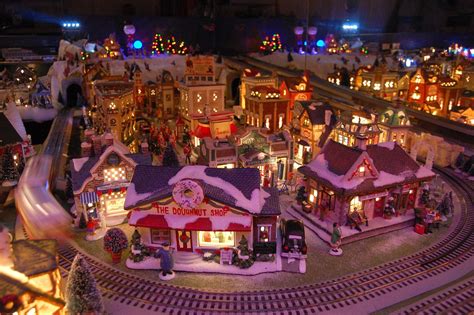 Our Yearly Christmas Village. Lionel train, trolley, 150 houses make up ...