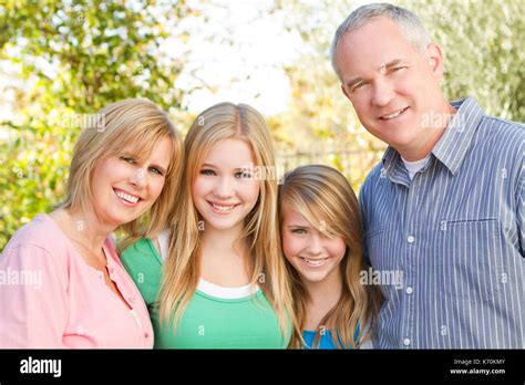 Happy family smiling Stock Photo - Alamy