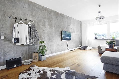 Living room with a concrete wall - COCO LAPINE DESIGNCOCO LAPINE DESIGN