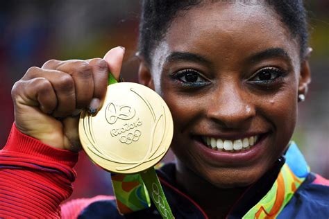 Simone Biles becomes fourth gymnast to win 4 gold medals in the Olympics