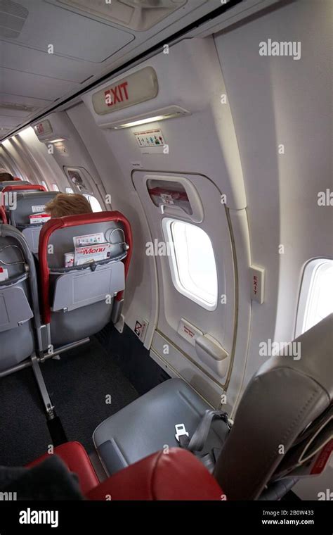 emergency exit and seating row with extra legroom inside boeing 737 ...