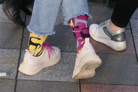 Legs in Bright Colored Socks and White Sneakers Stock Photo - Image of ...