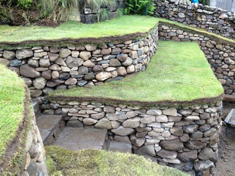 Dry stone retaining walls, steps and bench. At Carlops, Scotland, UK ...