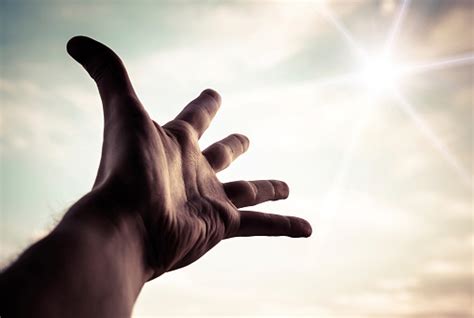 Hand Reaching To Towards Sky Stock Photo - Download Image Now - iStock