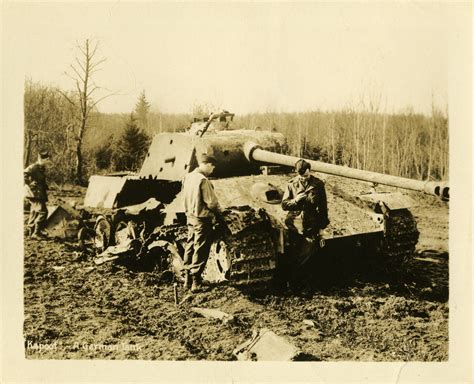 Servicemen standing next to a knocked out German Tiger II tank | The ...